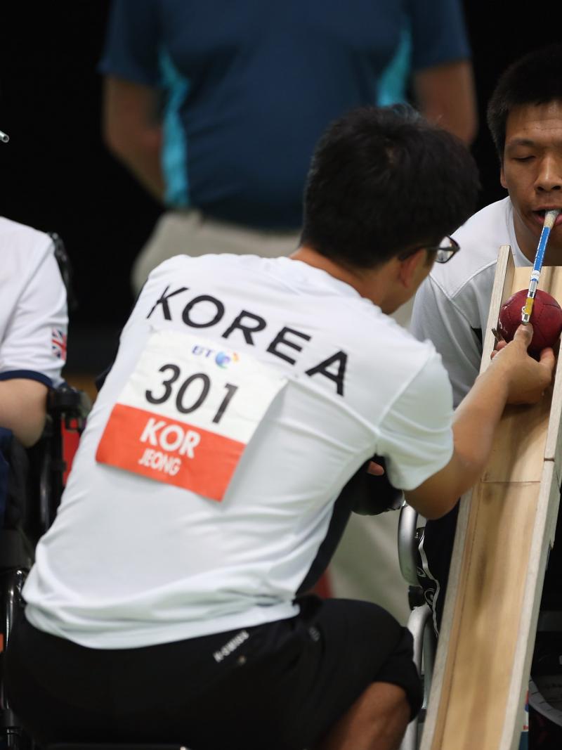 2 men playing Boccia