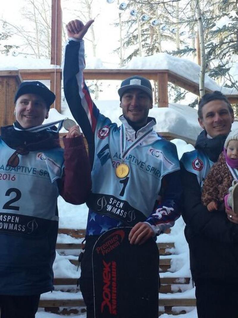 Three adaptive snowboarders celebrate their podium finishes at the 2016 IPC Snowboard World Cup in Aspen, USA