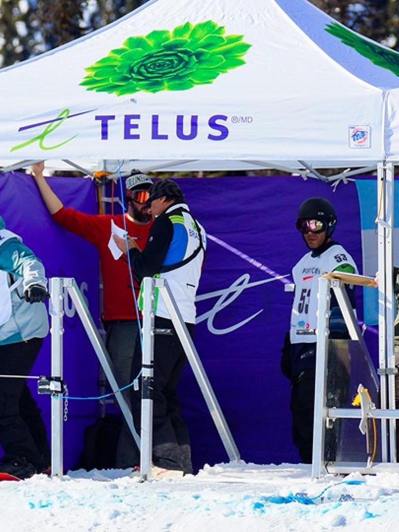 Snowboarders in the start boxes