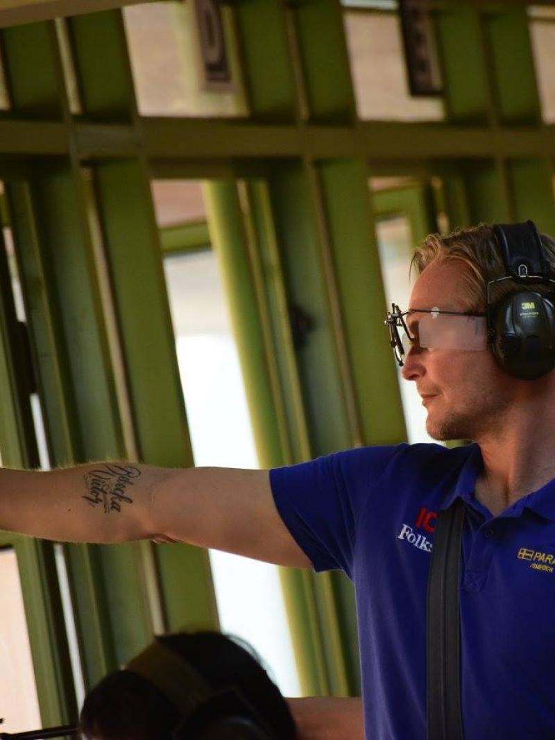 A man shooting a pistol