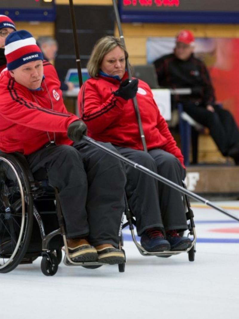 Wheelchair curlers in action