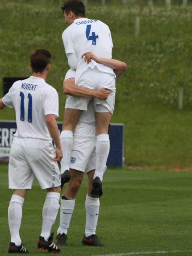 A football 7-a-side player celebrates scoring a goal