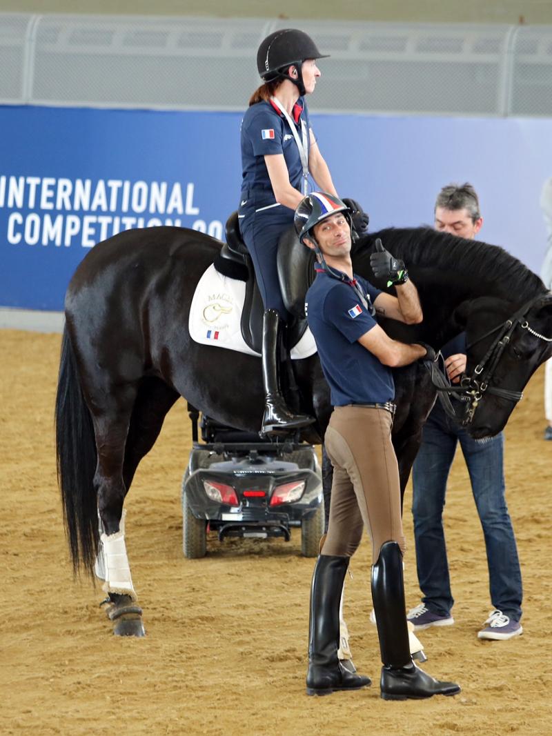 A rider on a black horse