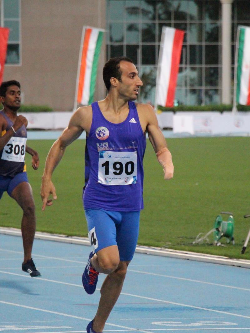A man crossses the finish line in celebration.