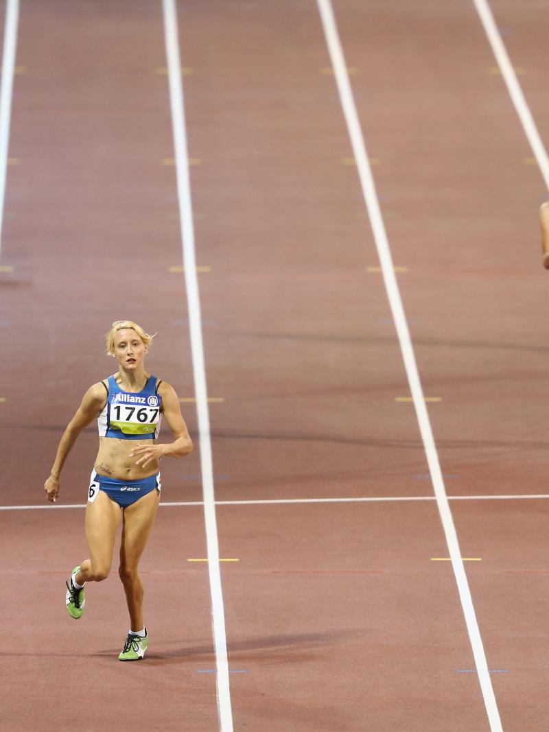 A para-athlete sprints towards the line