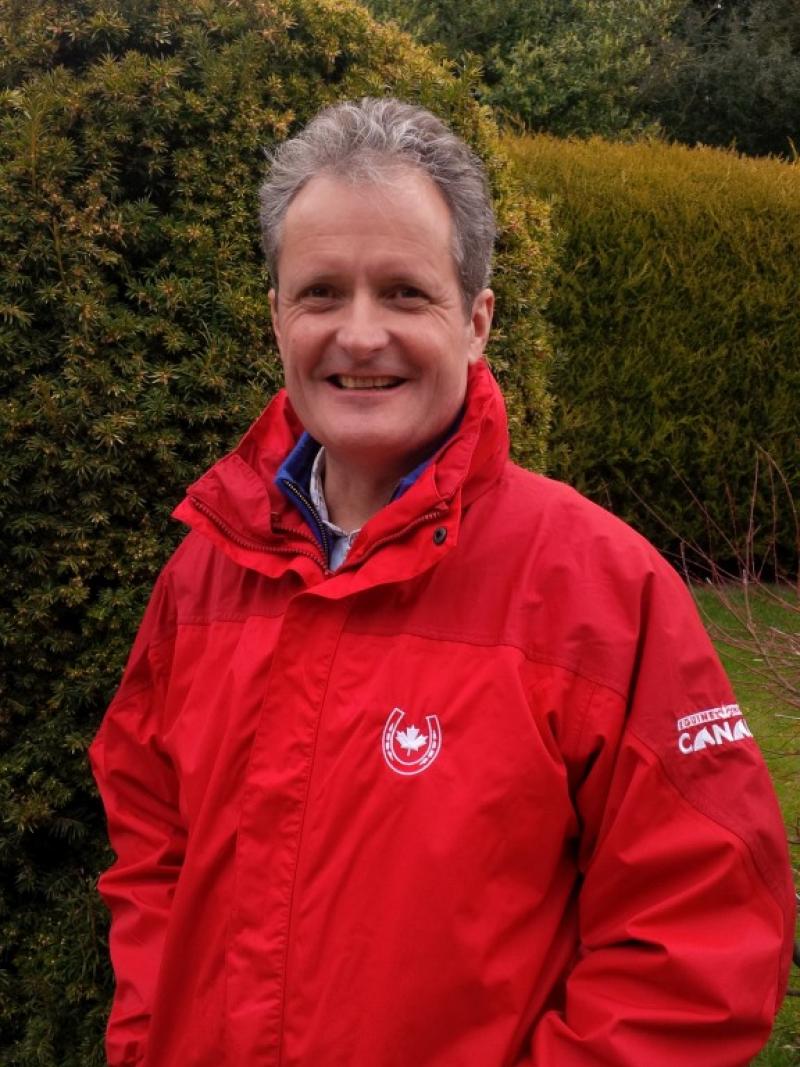 Portrait photo of a man in a red jacket