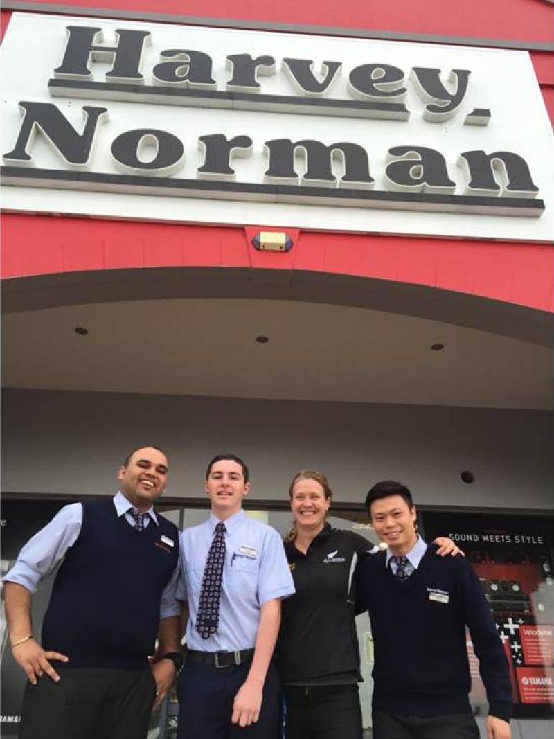 Fiona Allan, Chief Executive, PNZ, with members of the Harvey Norman's team.
