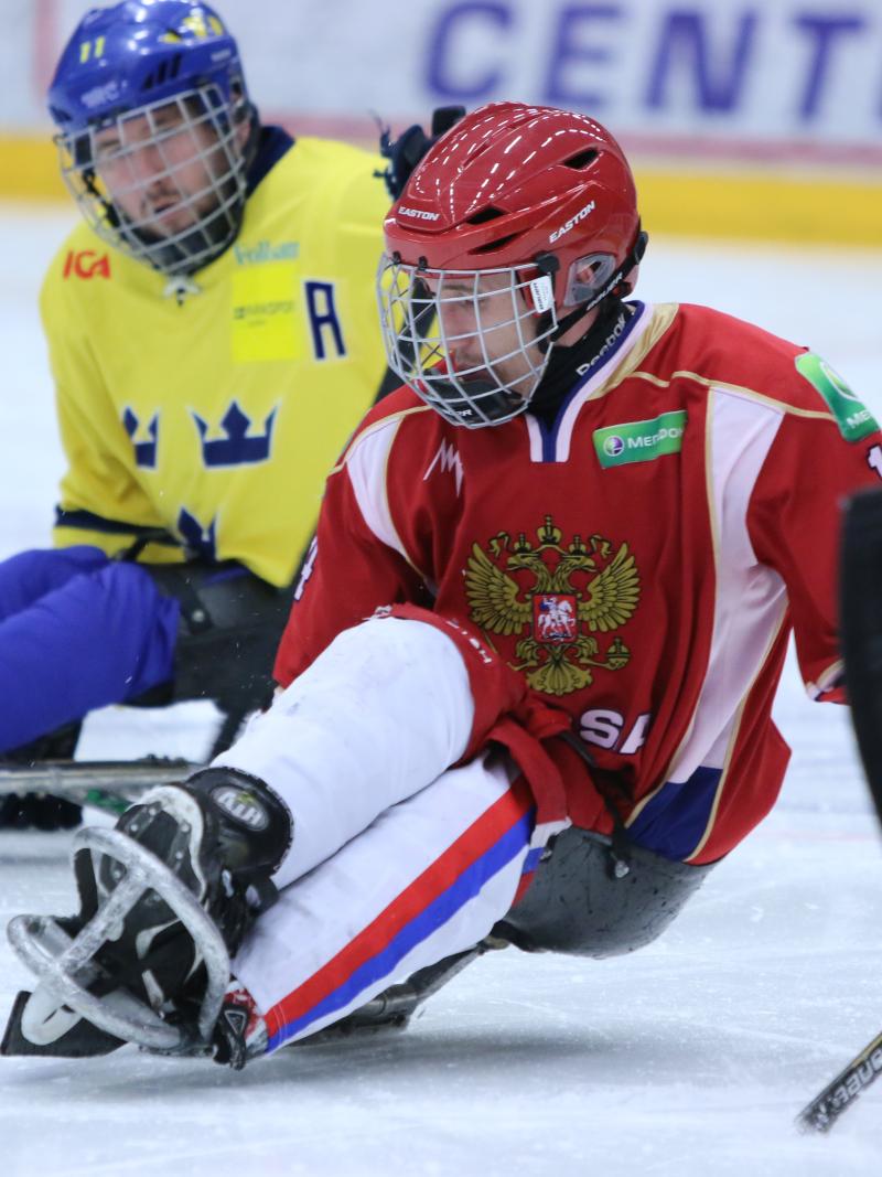 Ice sledge hockey players battle it out