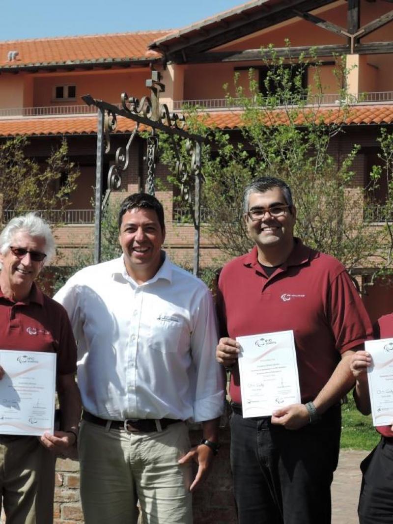 Newly trained Educators David Weicker, Frederico Nantes and Yukio Seki receive their course certificates from Flavio Santos