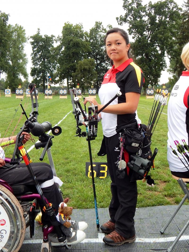 Three female archers posing
