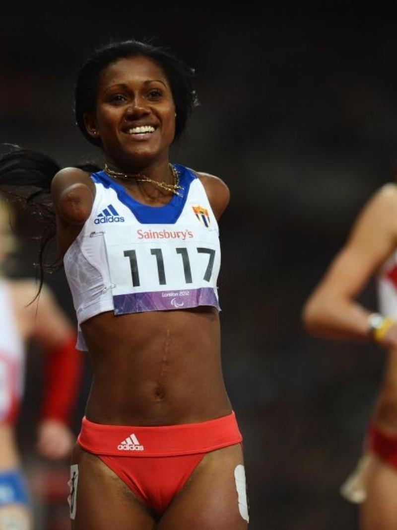 Yunidis Castillo of Cuba celebrates as she wins gold in the Women's 100m T46 Final at the London 2012 Paralympic Games.