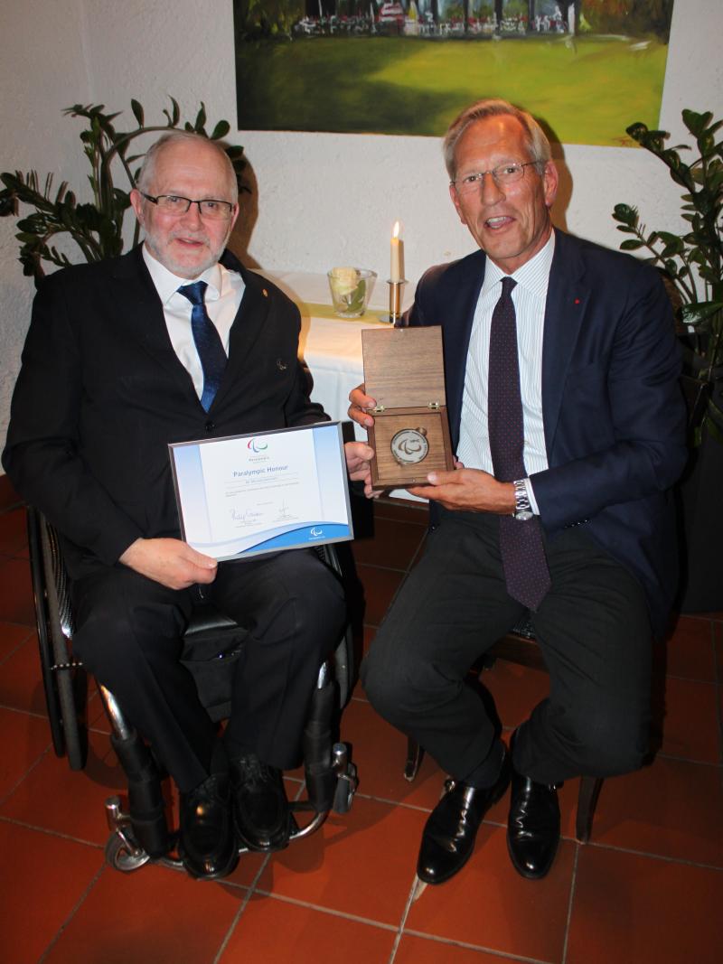 The former CEO of Allianz, Michael Diekmann, receives the Paralympic Honour from IPC President Sir Philip Craven on 15 April 2016.