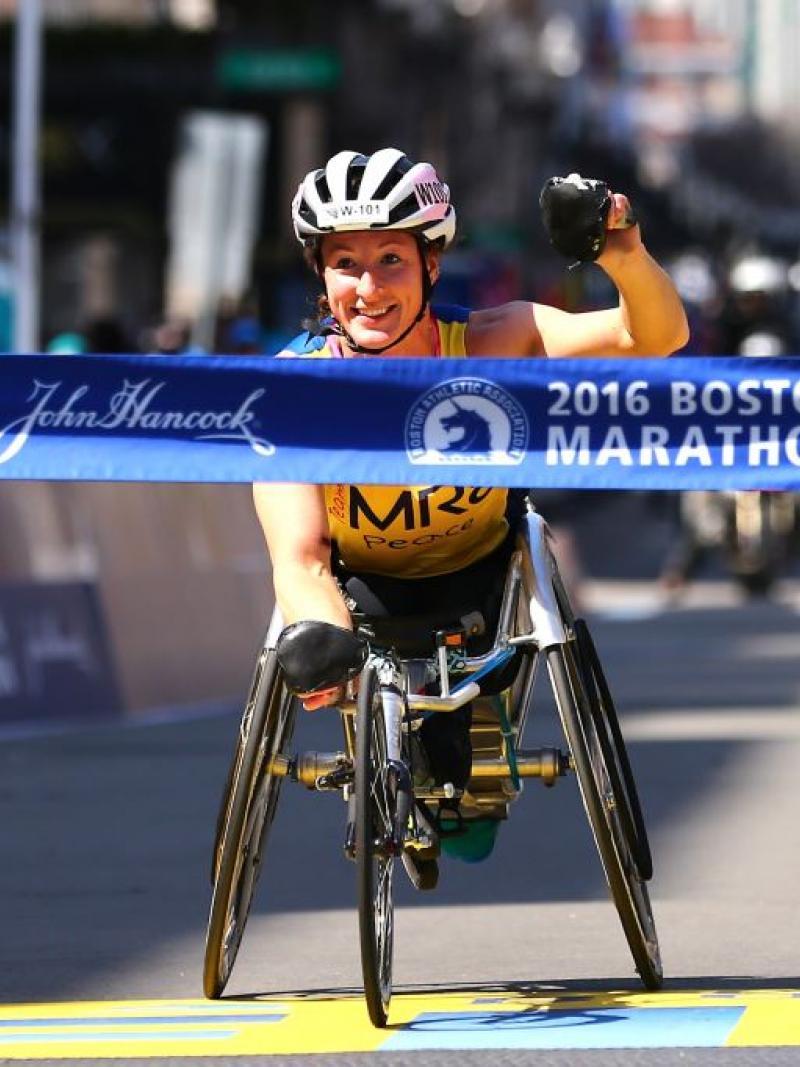 Tatyana McFadden of the United States crosses the finish line to win the women's push rim wheelchair race during the 120th Boston Marathon in Boston, Massachusetts.