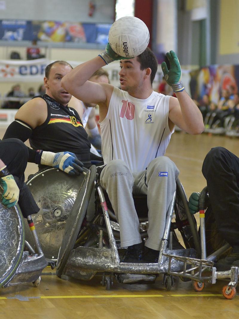 German wheelchair rugby players swarm a Danish player