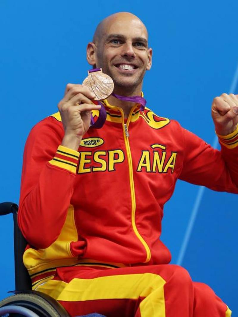 Bronze medallist Richard Oribe of Spain poses on the podium during the medal ceremony for the Men's 200m Freestyle - S4 final at the London 2012 Paralympic Games.