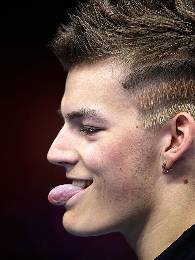 Portrait picture of a man showing his tongue.