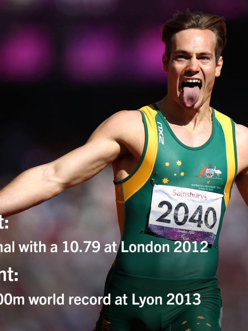 Man crossing a finish line on a track, celebrating
