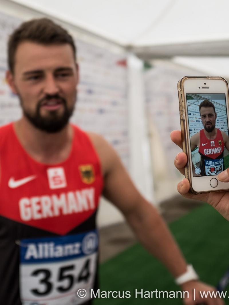 Man being filmed by a smartphone