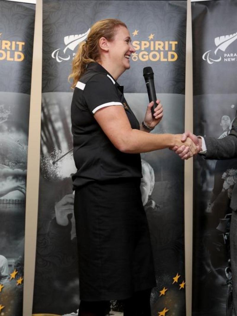 Paralympics NZ CEO Fiona Allan shakes hands with sponsor Marty Kerr from VISA