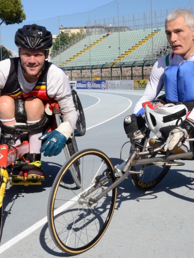 Two wheelchair racers on the track after their race
