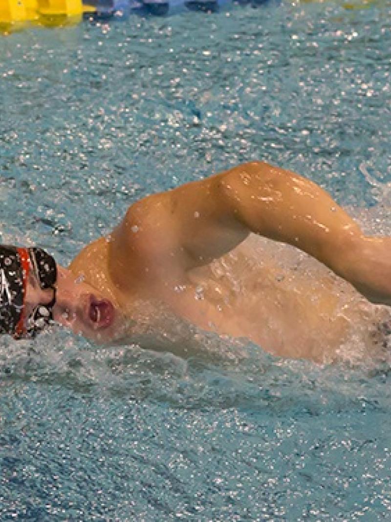 A Para swimmer competes in a race