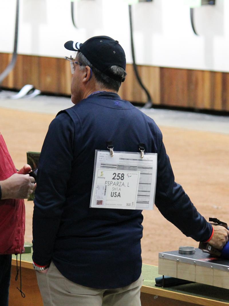 Two men in a shooting range, talking