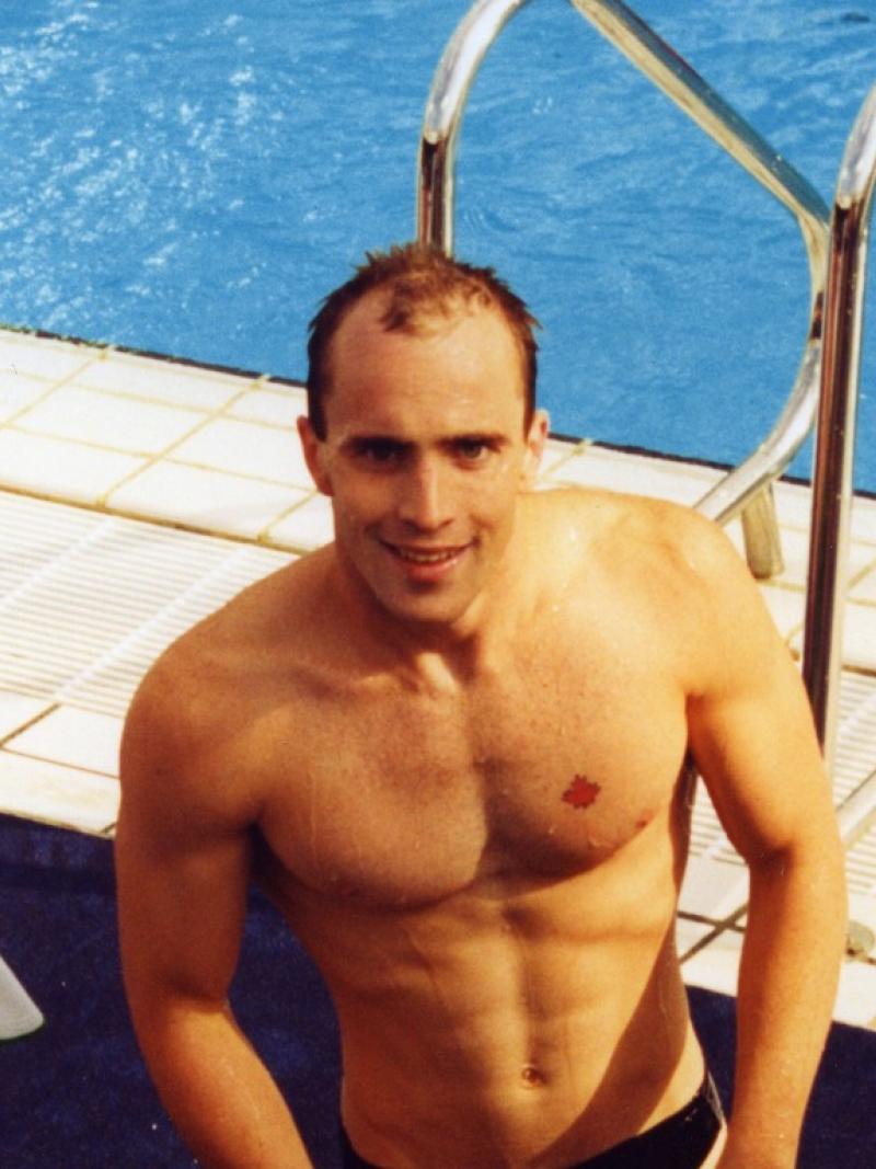 Canadian swimmer Michael Edgson stands next to the pool after competing at Barcelona 1992.