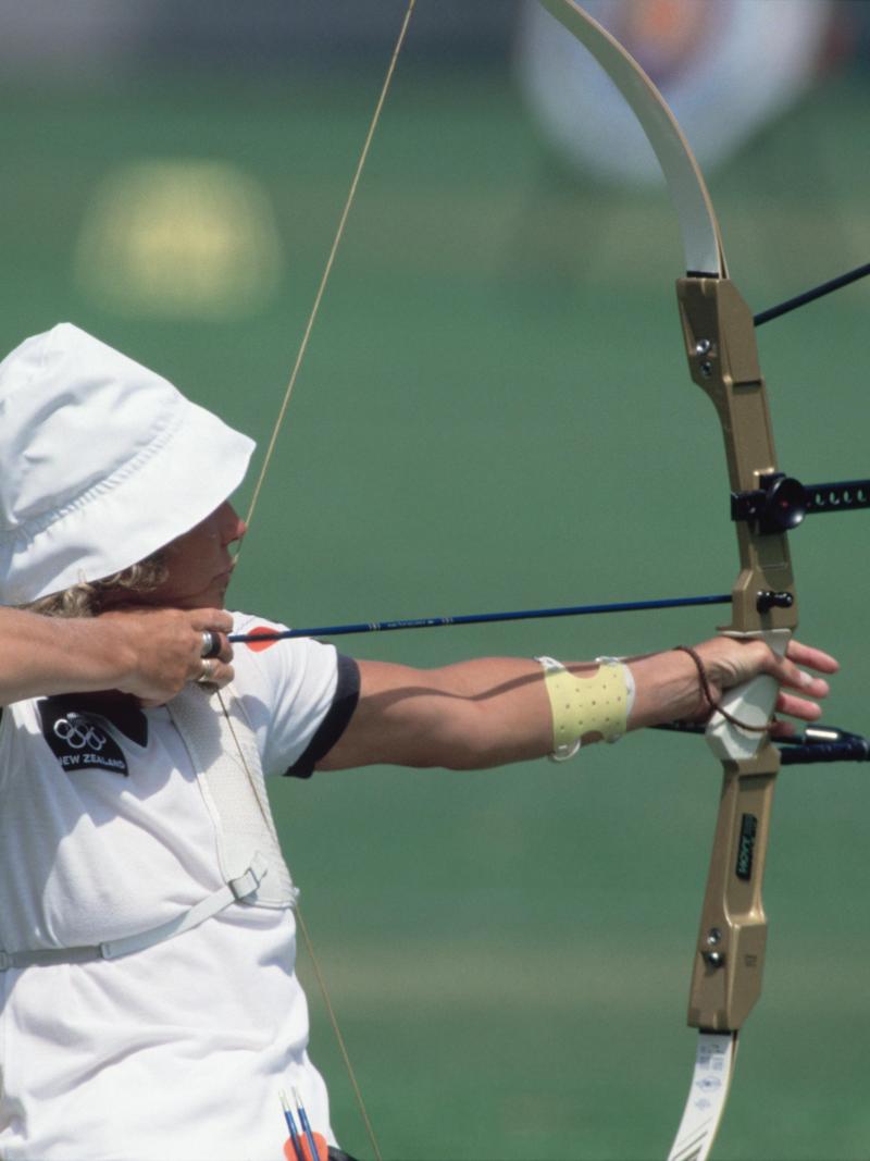 Woman in wheelchair doing archery
