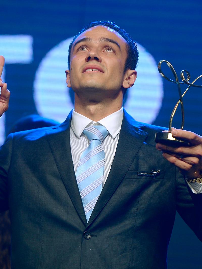 A Paralympian celebrates winning an award
