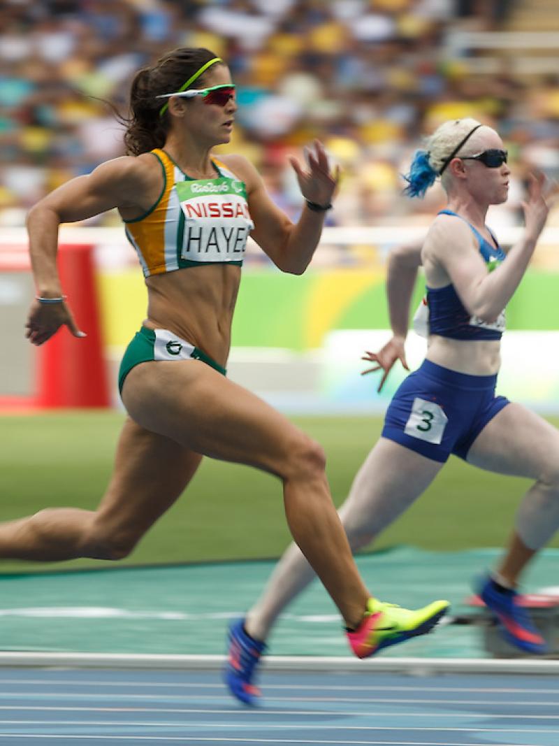 Ilse Hayes RSA and Kym Crosby USA compete in the Heat 2 of the Women's 100m - T13 at the Olympic Stadium.