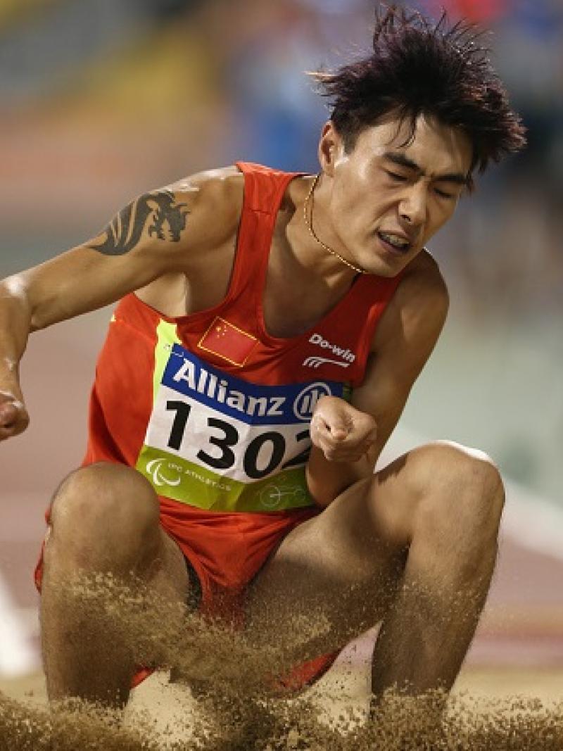 Guangxu Shang of China competes in the men's long jump T37.