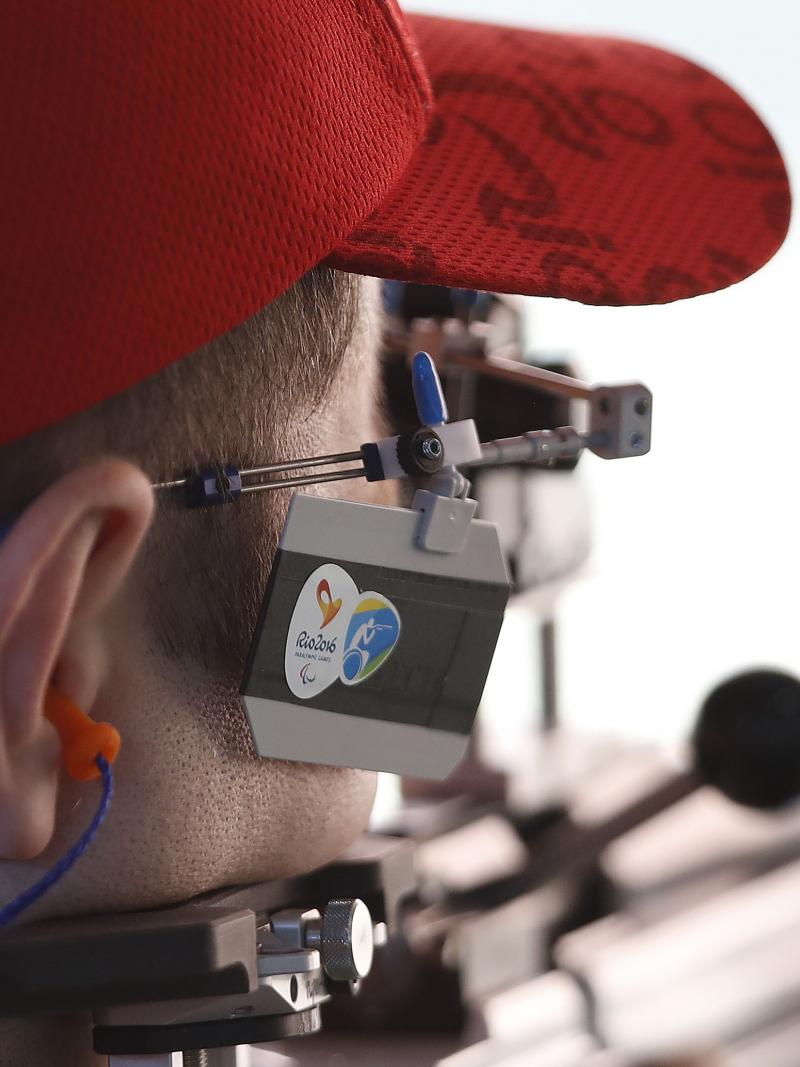 a male Para shooter takes a shot