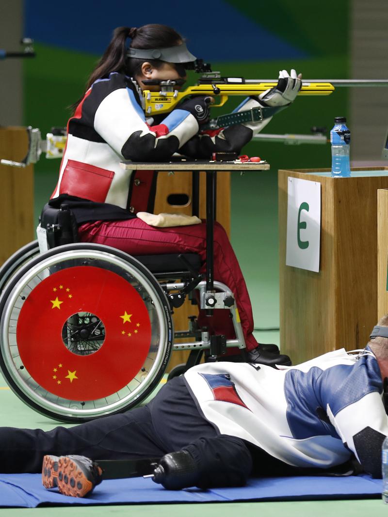Women in a wheelchair doing para sport shooting