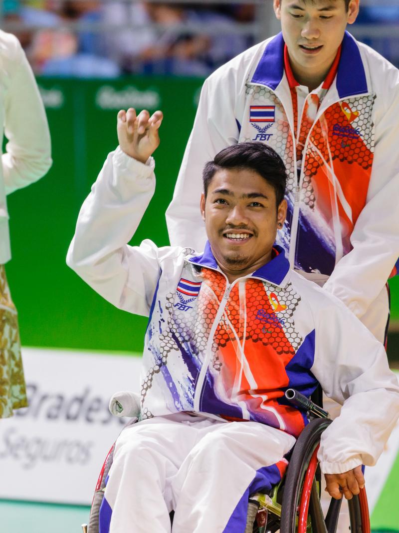 Man in wheelchair celebrating