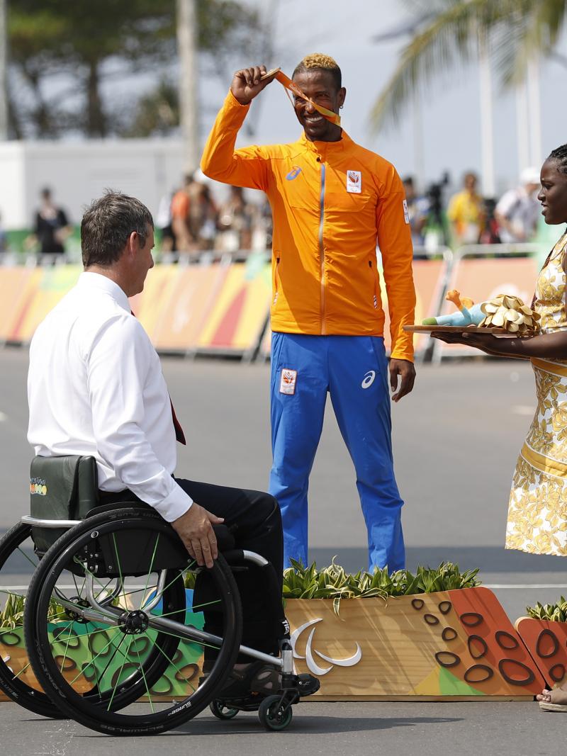 three men on a podium