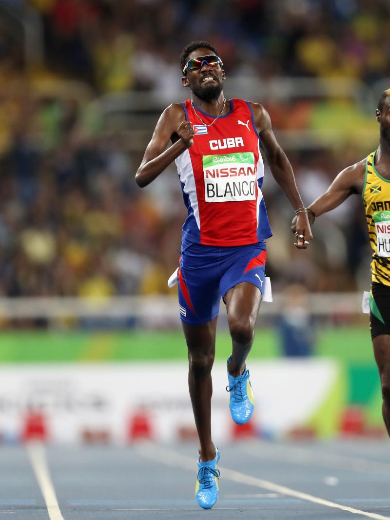 Three men finishing in the men's 400m competition