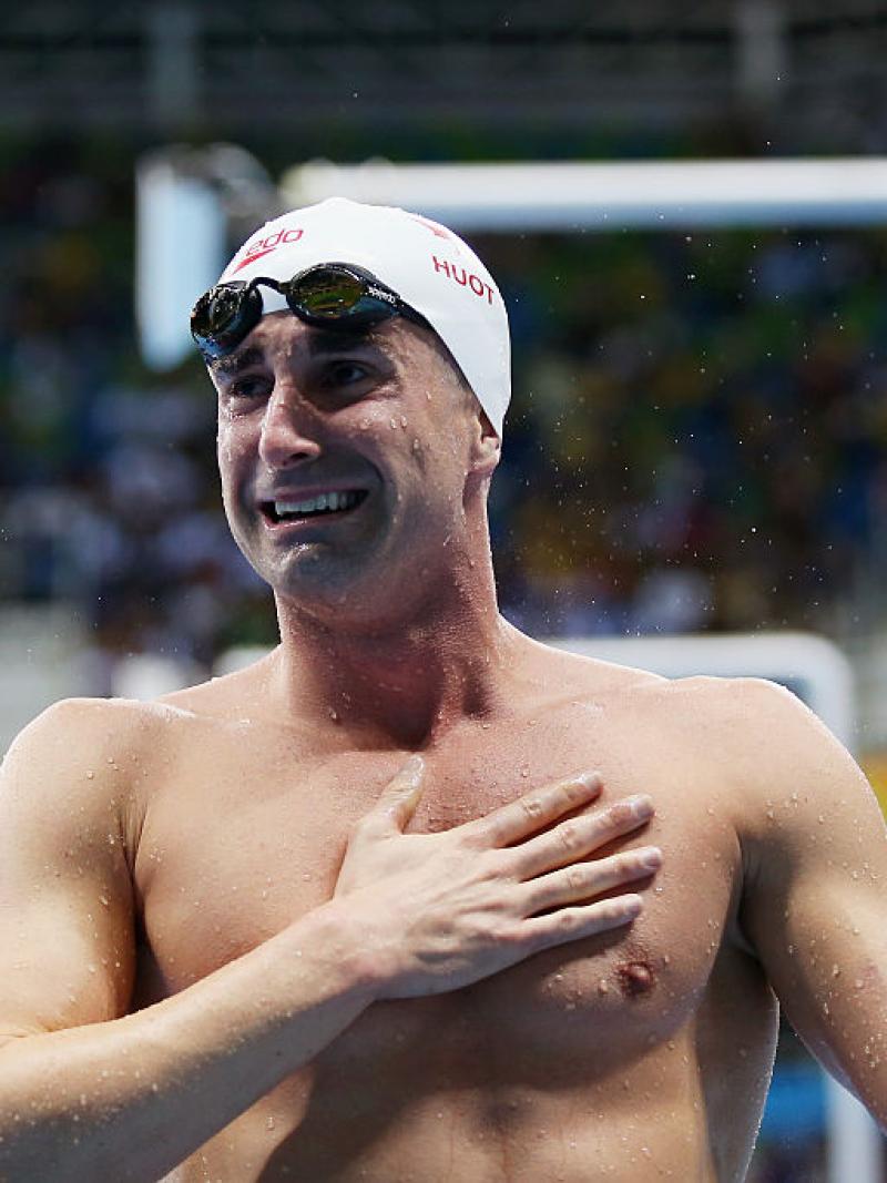 A swimmer is delighted with his victory.