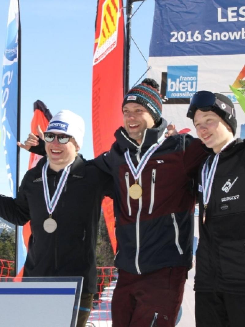 Three men on a podium