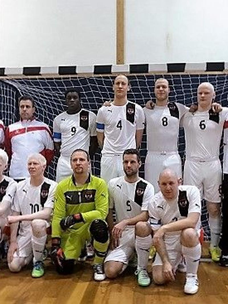 Team photo of men in white jerseys