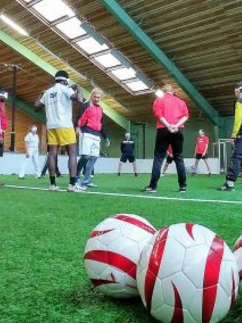 A female trainer coaches blind players in Vienna, Austria.