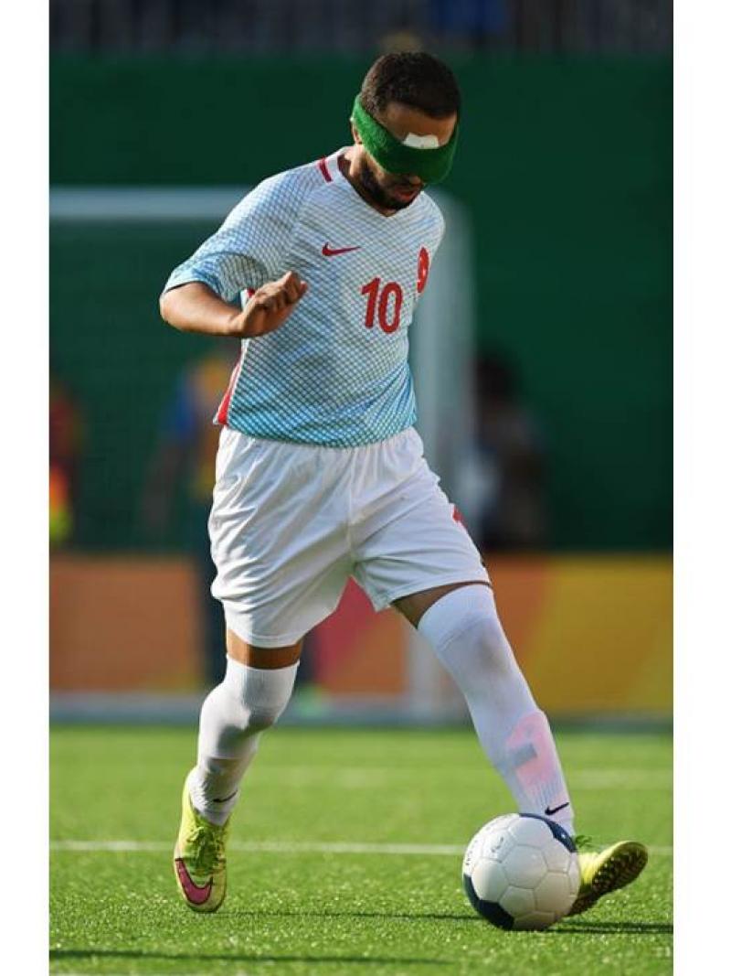 Celal Coban of Turkey runs with the ball in the men's football 5-a-side during the Rio 2016 Paralympic Games.