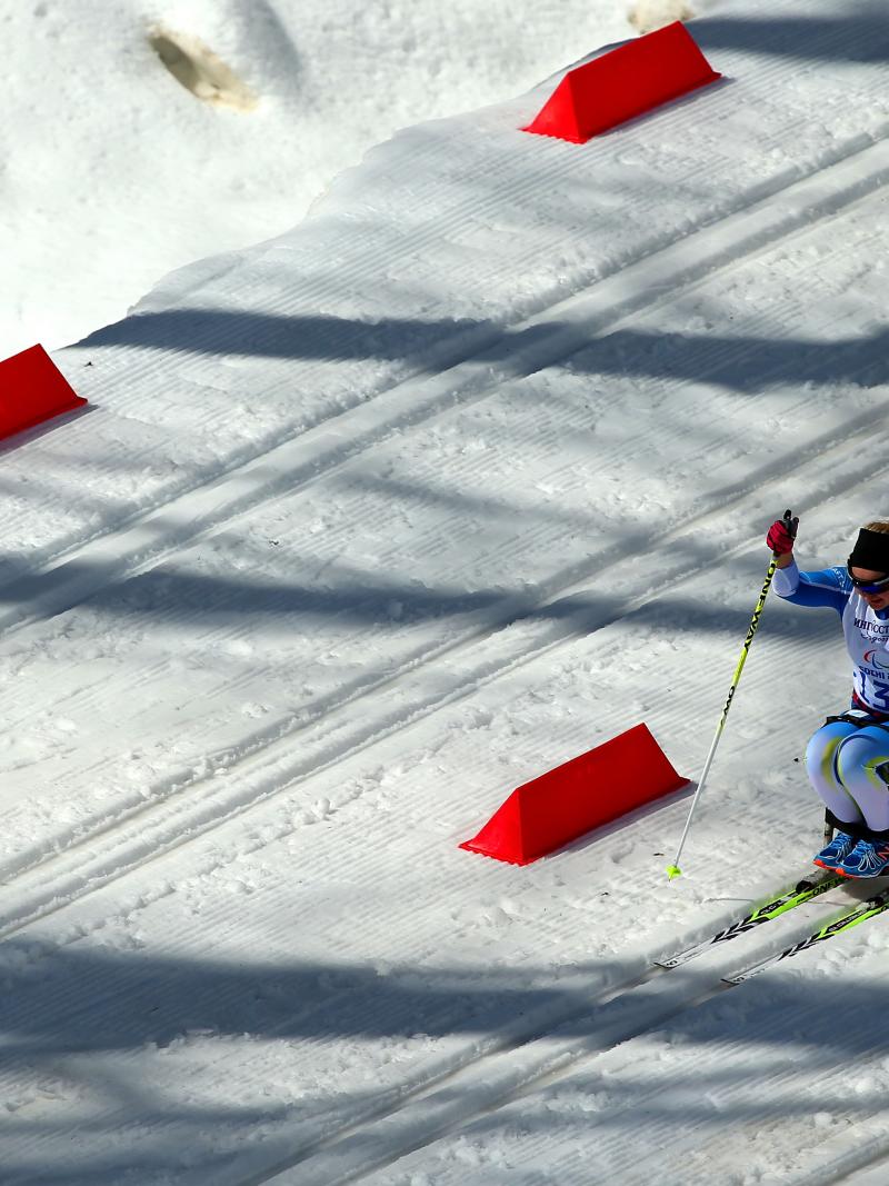 A female sit-skier takes to the trails