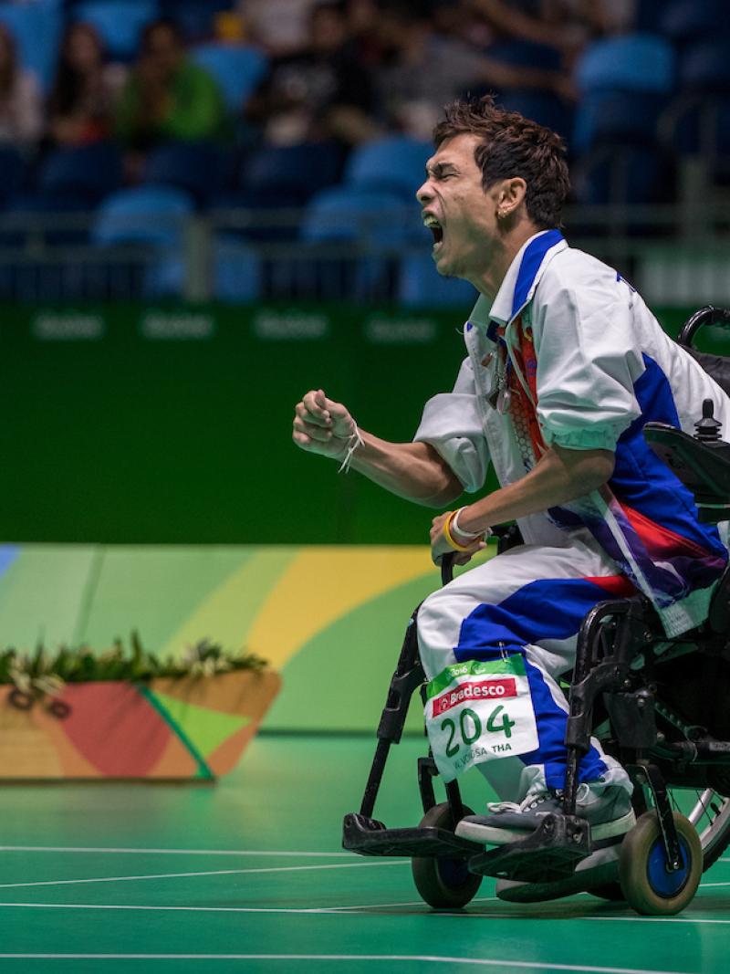 Man in wheelchair celebrates