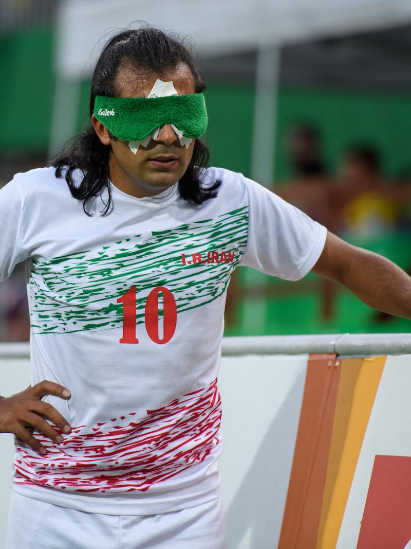 A blindfolded football 5-a-side player.