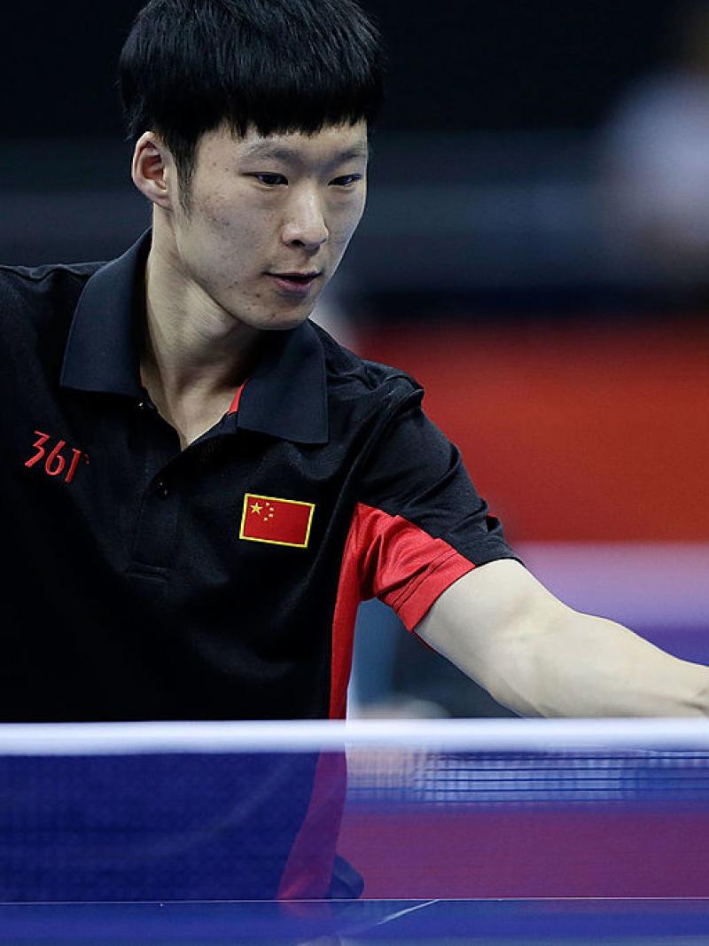Yang Ge of China returns serve against Sebastian Powrozniak of Poland during the final of the Men's Team Table Tennis - Class 9-10 London 2012