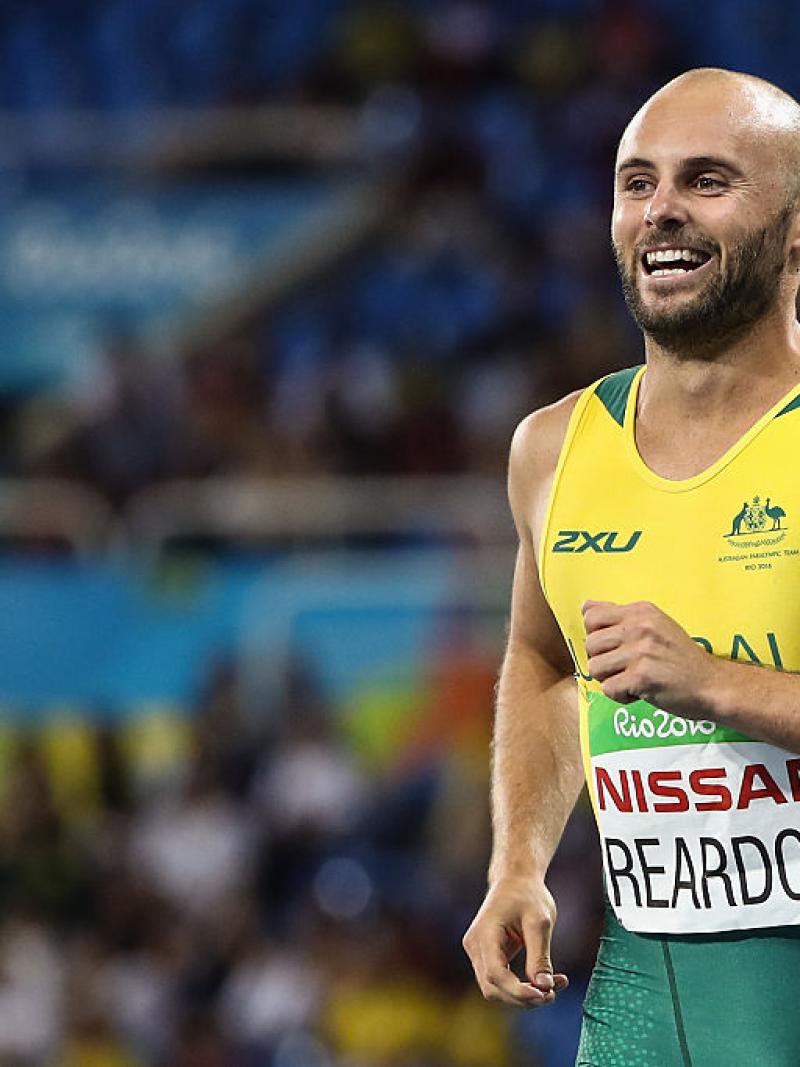 Scott Reardon of Australia celebrate winning the gold medal in the Men's 100m - T42 Final on day 8 of the Rio 2016 Paralympic Games