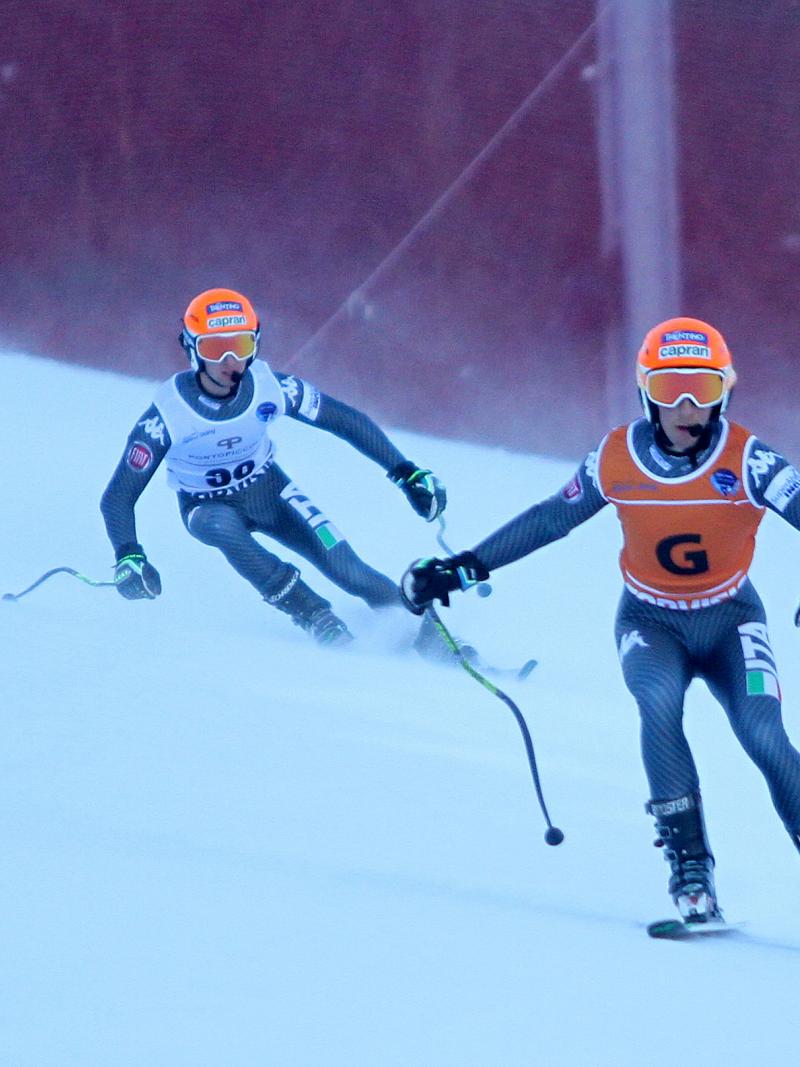A visually impaired skier takes a bend