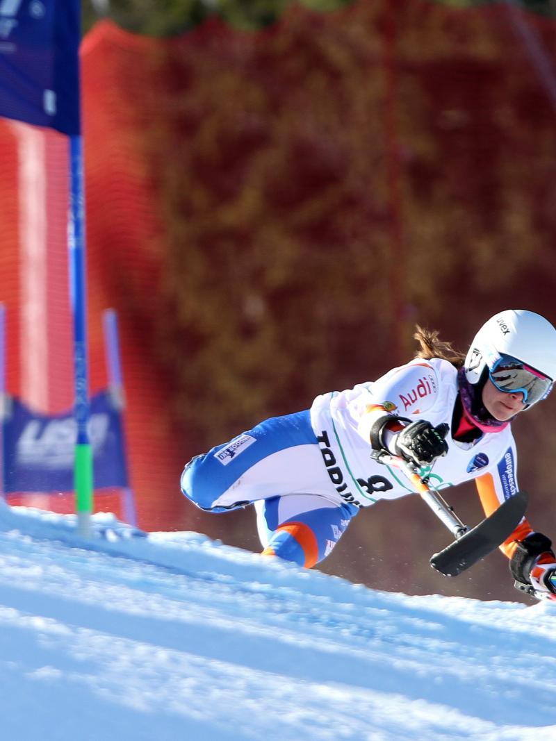 downhill skier going through a gate