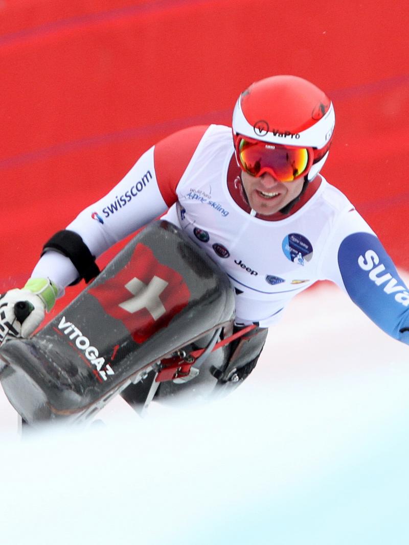 Man in sit ski in action on the slopes