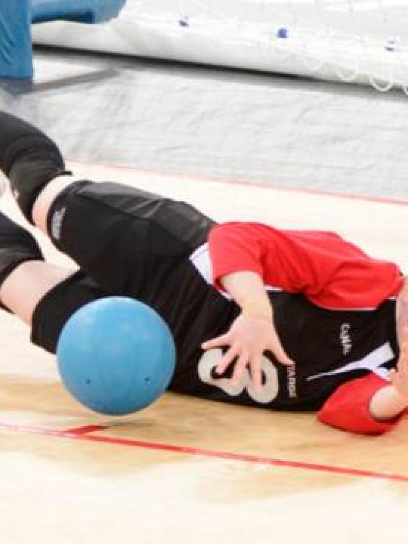 Blindfolded women stopping a ball